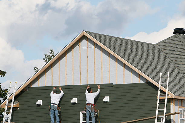 Professional Siding Contractor technician working in Manns Choice, PA